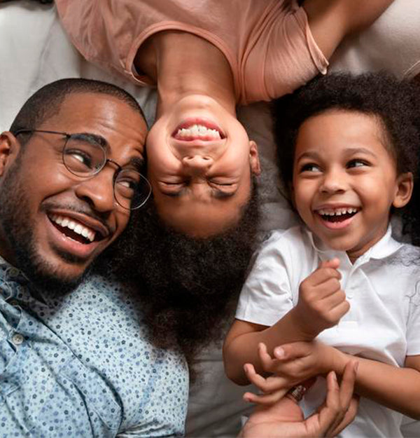 Young family laying on one of our mattresses that does not contain any chemical flame retardants.
