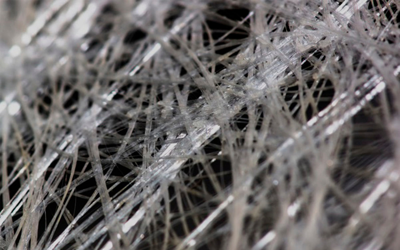 Closeup image of fiberglass illustrating shards of glass fibers