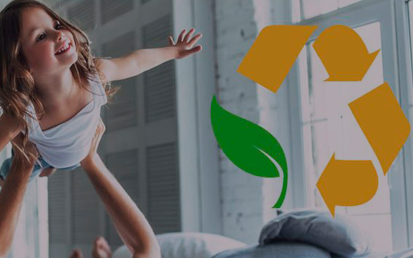 little girl on mattress with our recycling logo
