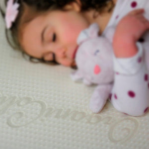 Close Up Of Our Harvest Organic Cotton Cover With Child Sleeping On It